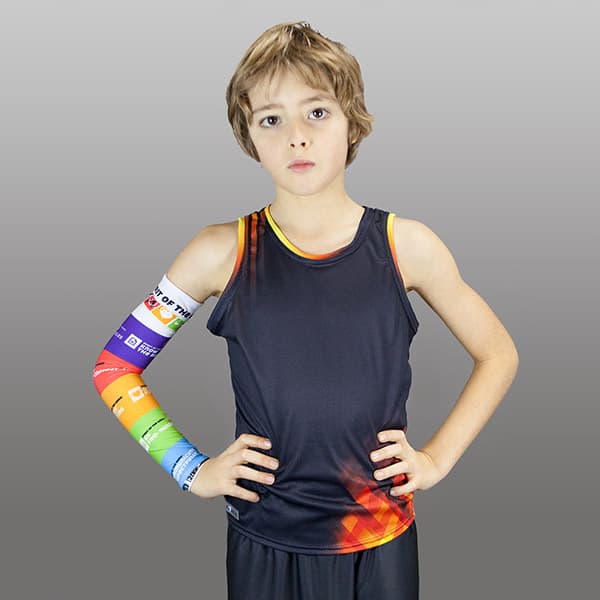 woman wearing a rainbow couloured compresion sleeve and a dark grey t-shirt