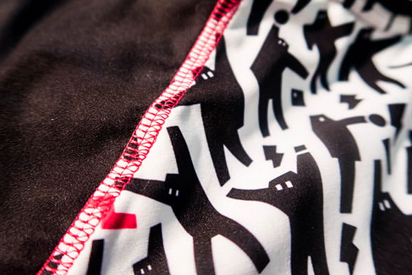 black and white sublimated textile with pink sewing stitches