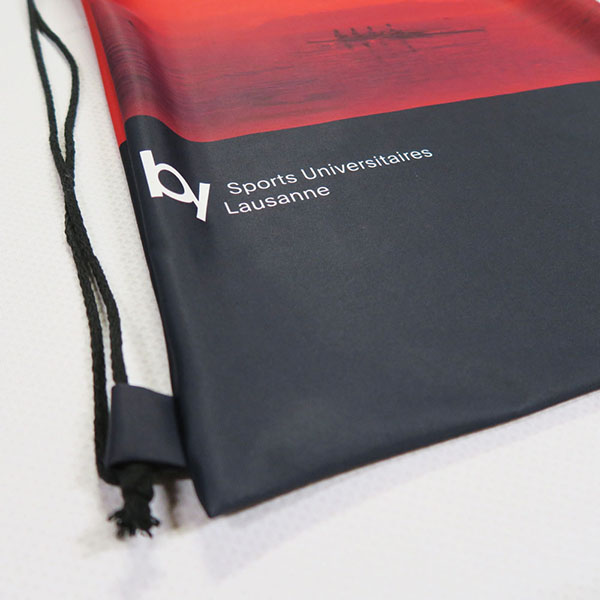 red and black textile with black drawstring