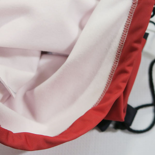 white and black textile with sewing stitches