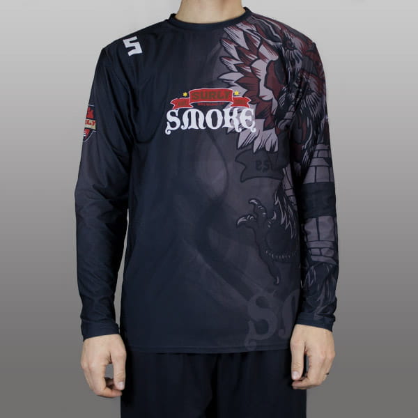 torso of man wearing a black jersey with long sleeves