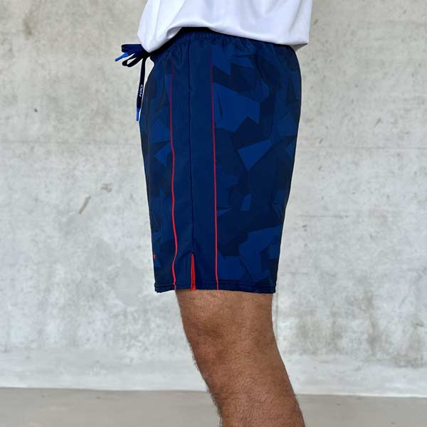 side view of man legs wearing blue shorts