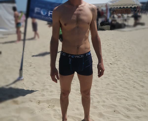 man body wearing blue sublimated underwear on beach